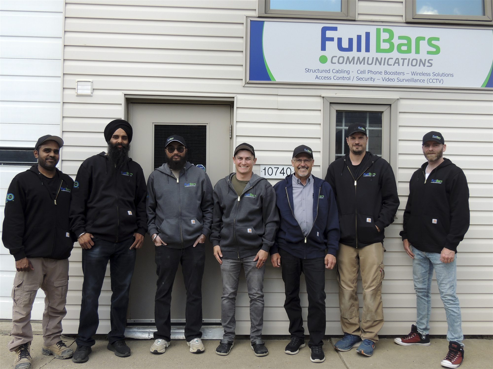 The Full Bars Communications team outside the Edmonton shop