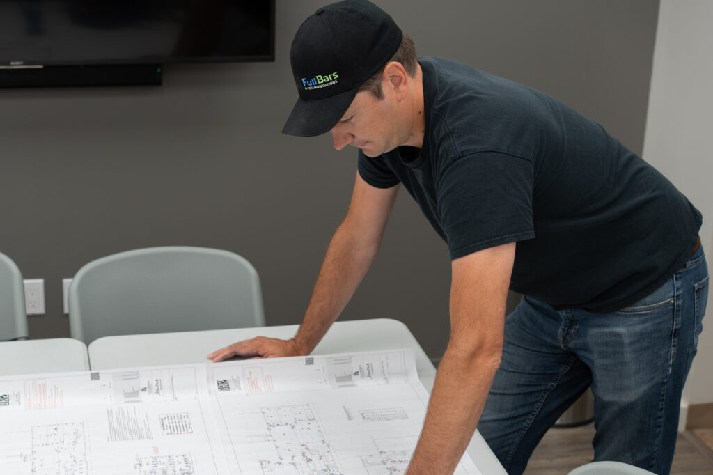 Full Bars technician reviewing construction drawings